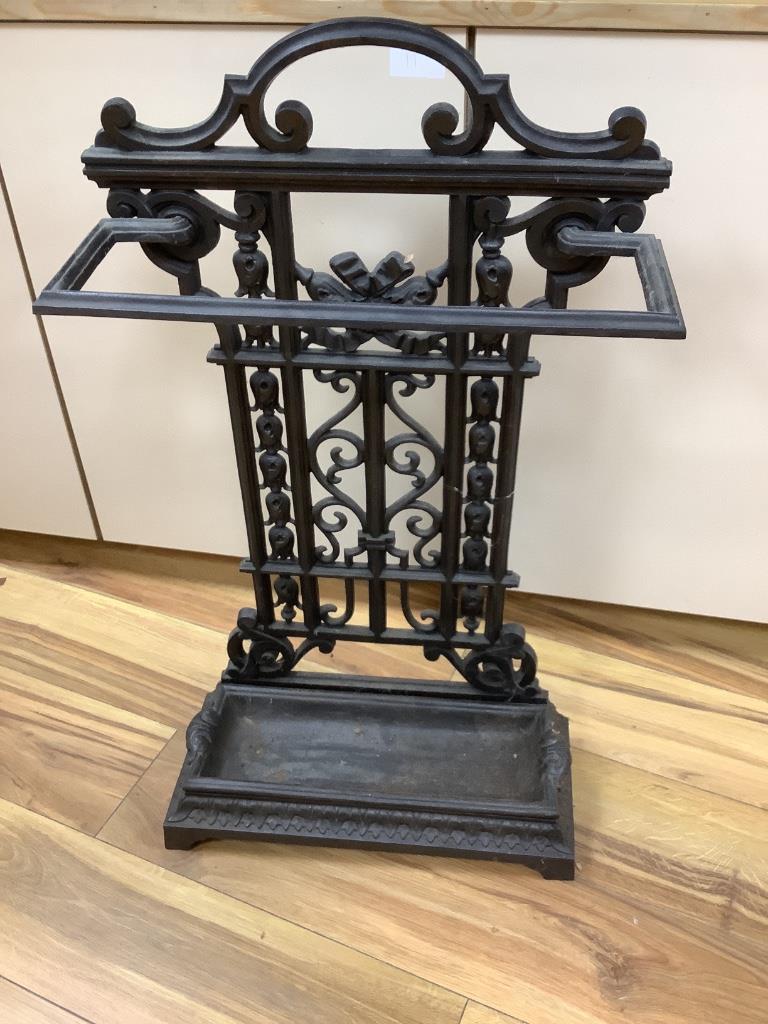 A cast iron umbrella stand